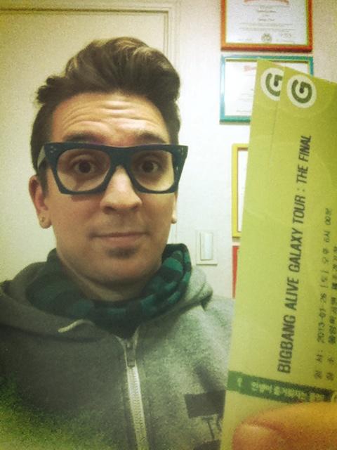 Busker Busker&rsquo;s Brad snaps a photo with his Big Bang concert tickets